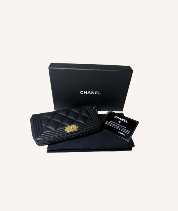 Chanel Boy leather zip-around wallet with quilted design and iconic Boy clasp