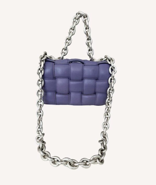 Close-up of Bottega Veneta purple leather Cassette Bag with silver chain handle