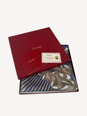 Elegant Cartier Must De Cartier scarf featuring a black panther motif with colorful floral accents, crafted from silk