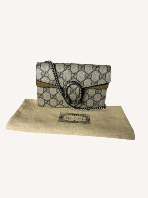 Designer Gucci mini crossbody bag in beige GG canvas with silver chain strap