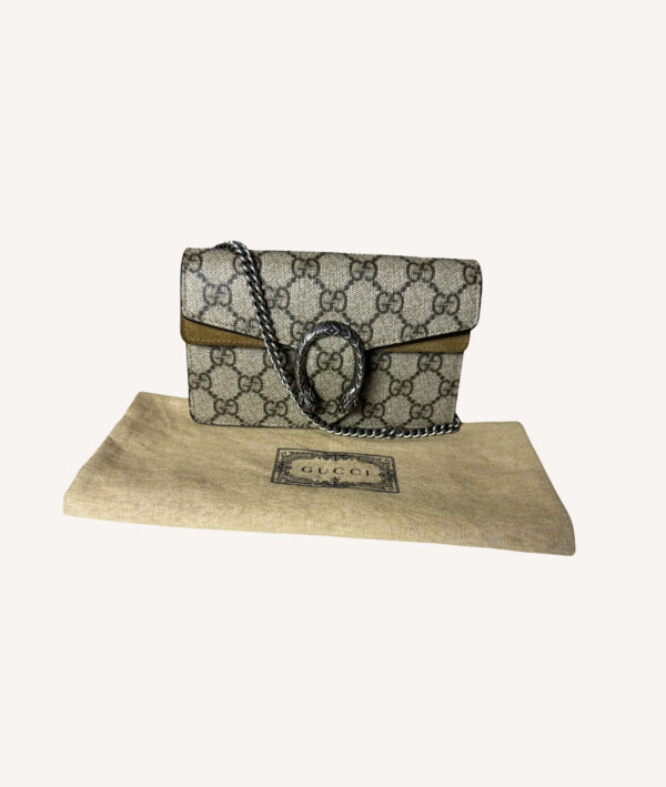 Designer Gucci mini crossbody bag in beige GG canvas with silver chain strap