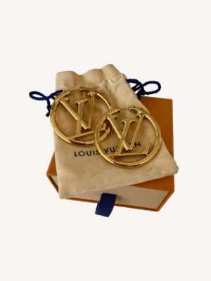 Oversized designer hoop earrings by Louis Vuitton with signature logo detail