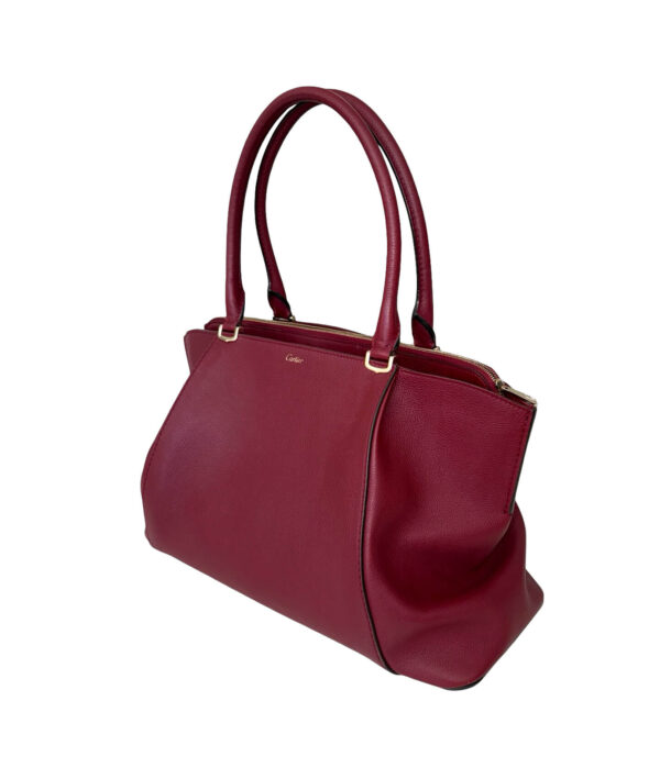 C De Cartier bag crafted from luxurious spinel bull calfskin in deep burgundy shade