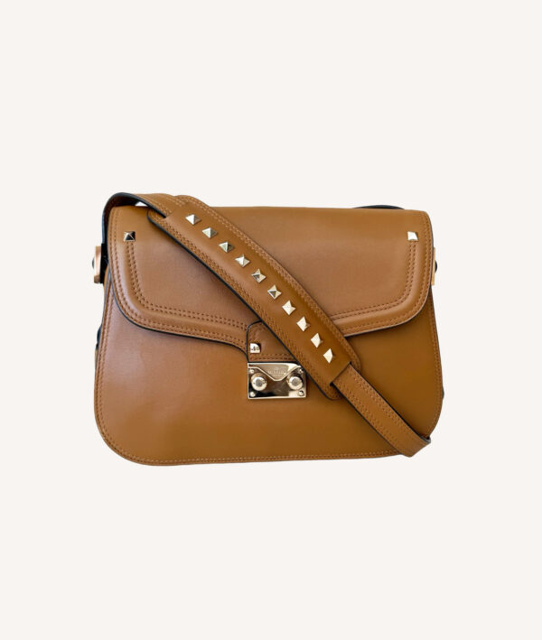 Designer Valentino saddle shoulder bag with signature Rockstud embellishments