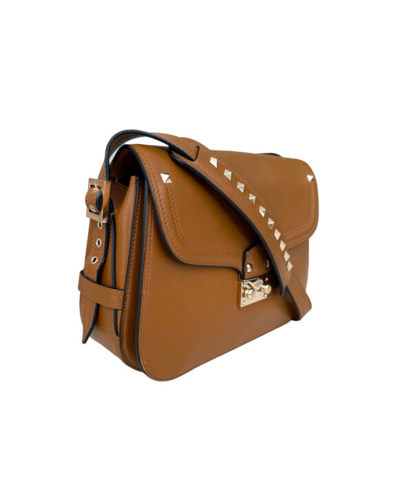 Luxury Valentino leather bag in brown with adjustable strap and flap closure