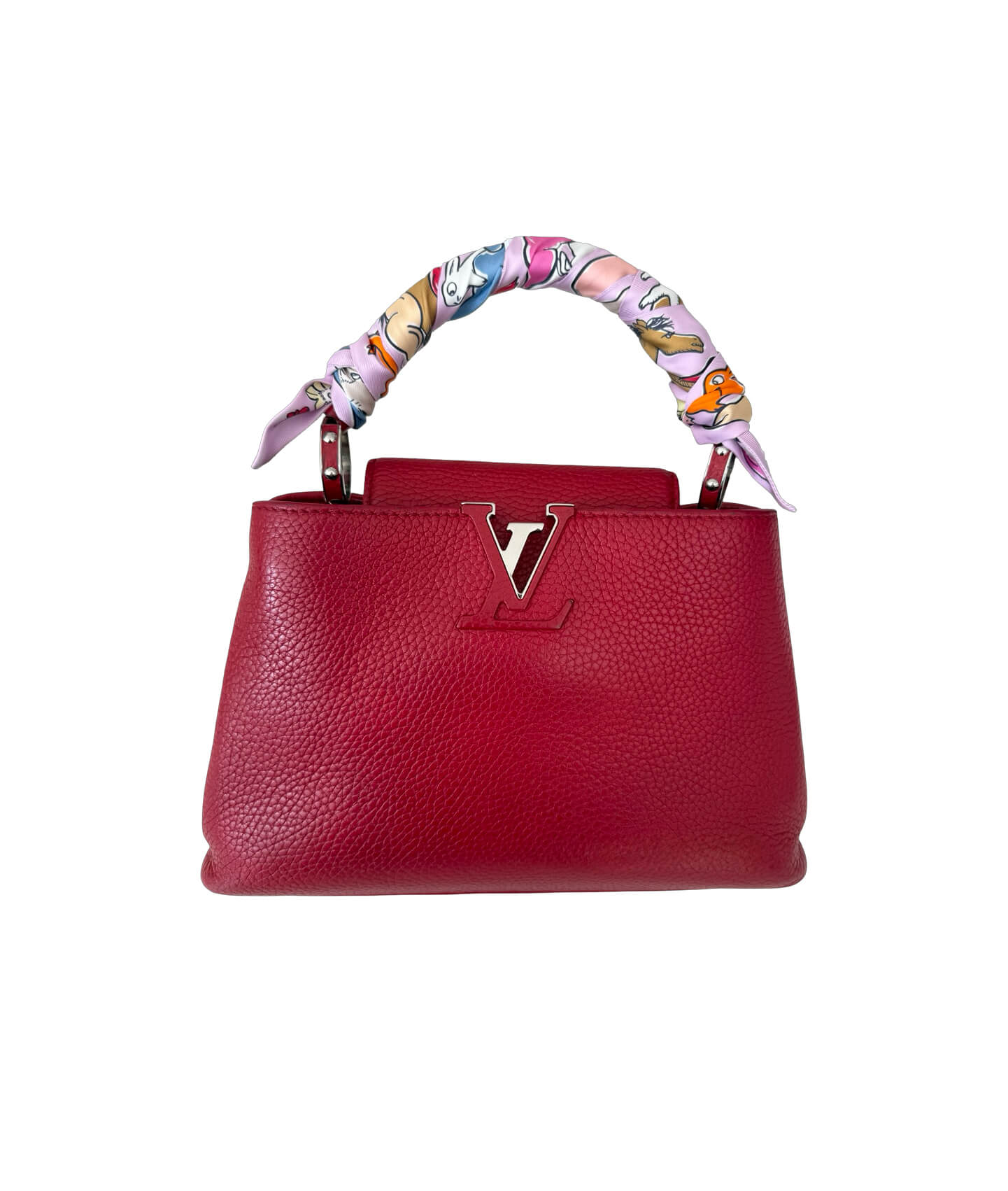 Close-up of Hermès Twilly Mille et un Lapins silk scarf featuring whimsical bunny motif in purple and tan tones