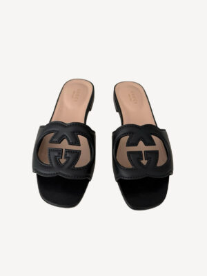 Black Gucci leather sandals featuring interlocking G logo and block heel